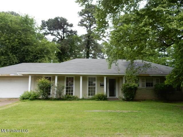 1510 Springridge Dr, Jackson, MS 39211 - ranch-style home with an attached garage, a front lawn, and driveway