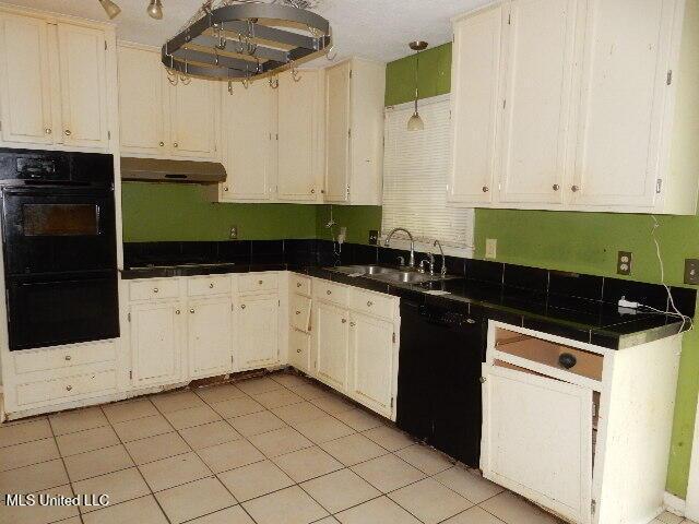 1510 Springridge Dr, Jackson, MS 39211 - kitchen featuring a sink, under cabinet range hood, black appliances, and white cabinets