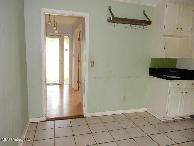 1510 Springridge Dr, Jackson, MS 39211 - unfurnished dining area with baseboards and ornamental molding