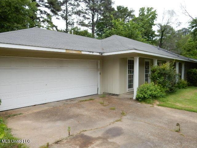 1510 Springridge Dr, Jackson, MS 39211 - view of front of home featuring an attached garage and driveway