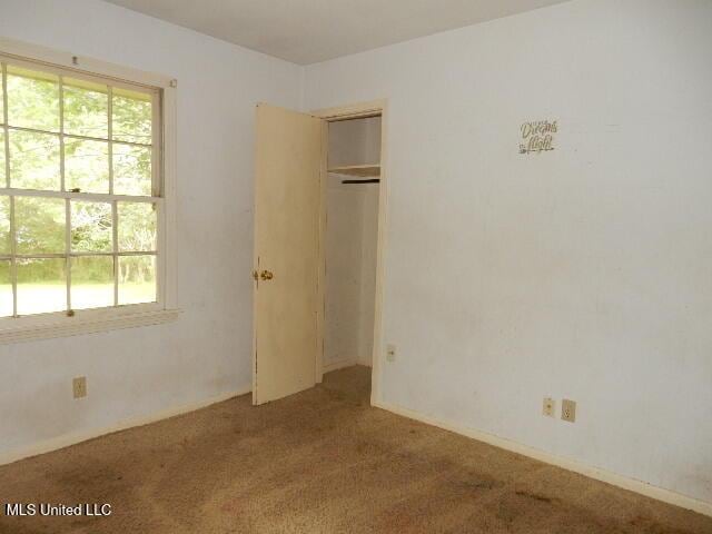 1510 Springridge Dr, Jackson, MS 39211 - unfurnished bedroom with carpet floors and a closet