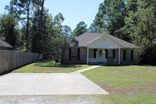 ranch-style house with covered porch and a front lawn