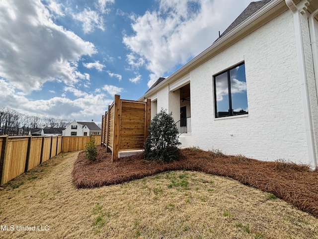 view of property exterior with a yard