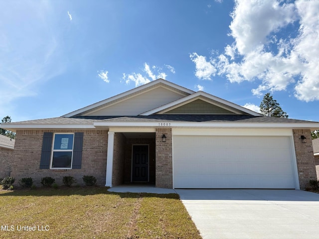18085 Tiffany Renee Dr, Gulfport, MS 39503 - ranch-style house with an attached garage, a front lawn, driveway, and brick siding