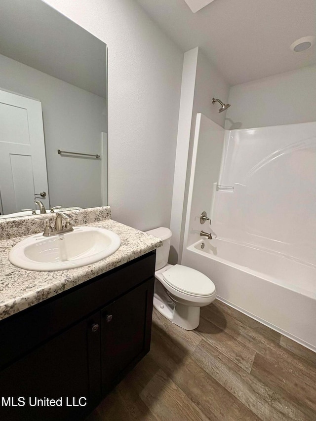 18085 Tiffany Renee Dr, Gulfport, MS 39503 - full bath featuring toilet, shower / washtub combination, wood finished floors, and vanity