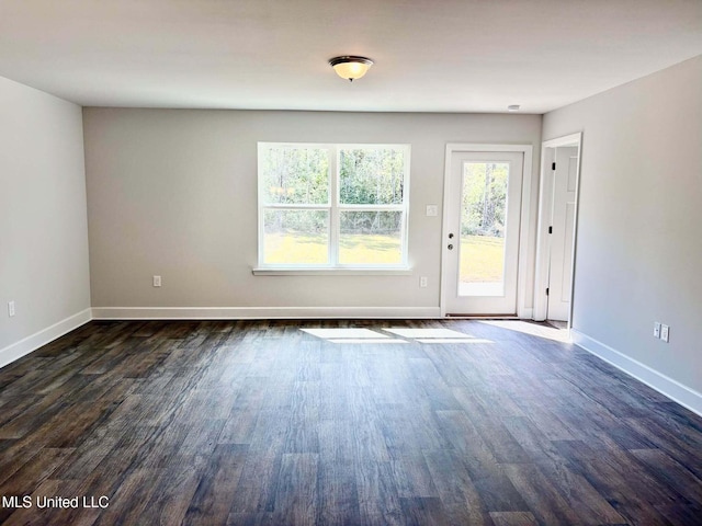 18085 Tiffany Renee Dr, Gulfport, MS 39503 - unfurnished room with baseboards and dark wood-style flooring