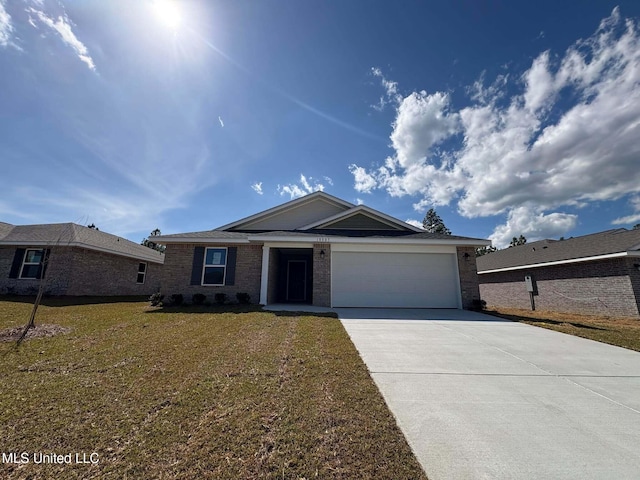 18085 Tiffany Renee Dr, Gulfport, MS 39503 - ranch-style house with an attached garage, brick siding, driveway, and a front yard