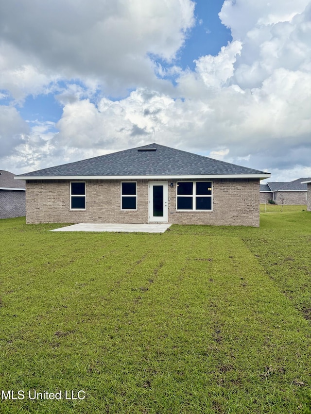 18085 Tiffany Renee Dr, Gulfport, MS 39503 - back of house with a lawn and a patio area