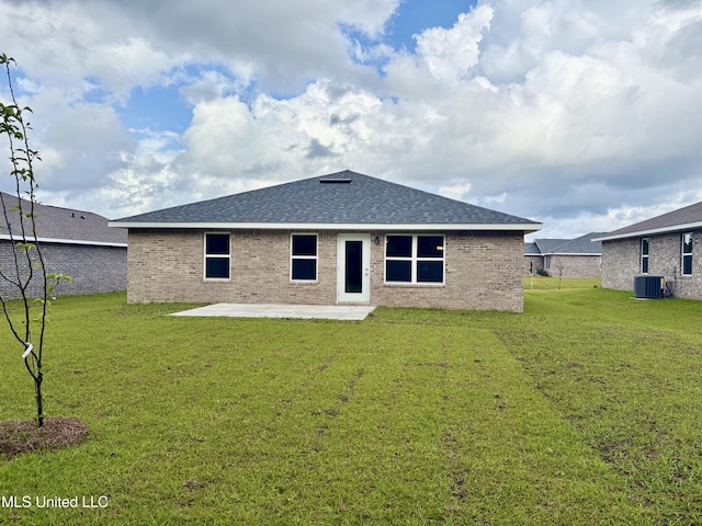 18085 Tiffany Renee Dr, Gulfport, MS 39503 - back of house with a lawn, a patio area, central air condition unit, and brick siding