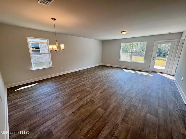 18085 Tiffany Renee Dr, Gulfport, MS 39503 - unfurnished dining area featuring baseboards, visible vents, dark wood-style flooring, and a chandelier