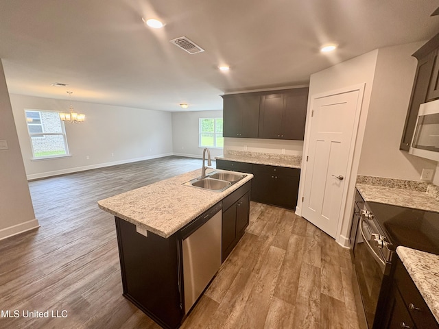 18085 Tiffany Renee Dr, Gulfport, MS 39503 - kitchen with an inviting chandelier, a sink, stainless steel appliances, wood finished floors, and visible vents