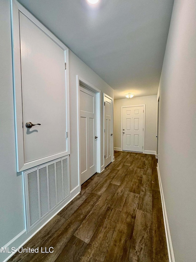 18085 Tiffany Renee Dr, Gulfport, MS 39503 - corridor with dark wood-style flooring, baseboards, and visible vents