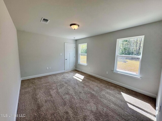 18085 Tiffany Renee Dr, Gulfport, MS 39503 - spare room with baseboards, carpet floors, and visible vents