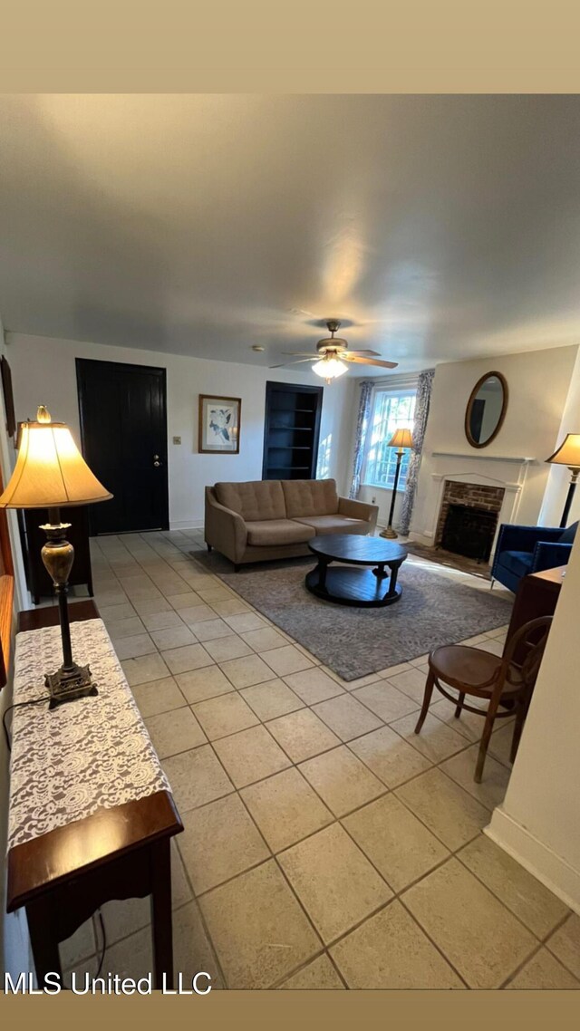 305 N Rankin St, Natchez, MS 39120 - tiled living room featuring ceiling fan