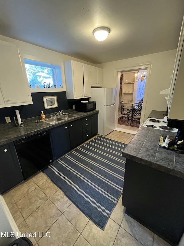 305 N Rankin St, Natchez, MS 39120 - kitchen featuring sink, white cabinets, a chandelier, light tile patterned flooring, and black appliances