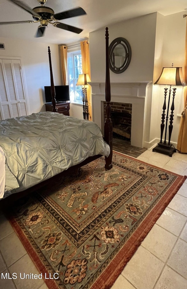 305 N Rankin St, Natchez, MS 39120 - tiled bedroom featuring ceiling fan and a closet