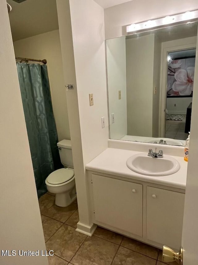 305 N Rankin St, Natchez, MS 39120 - bathroom with tile patterned floors, a shower with curtain, and toilet