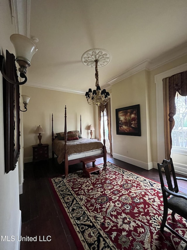 305 N Rankin St, Natchez, MS 39120 - bedroom with a notable chandelier, dark hardwood / wood-style flooring, and ornamental molding