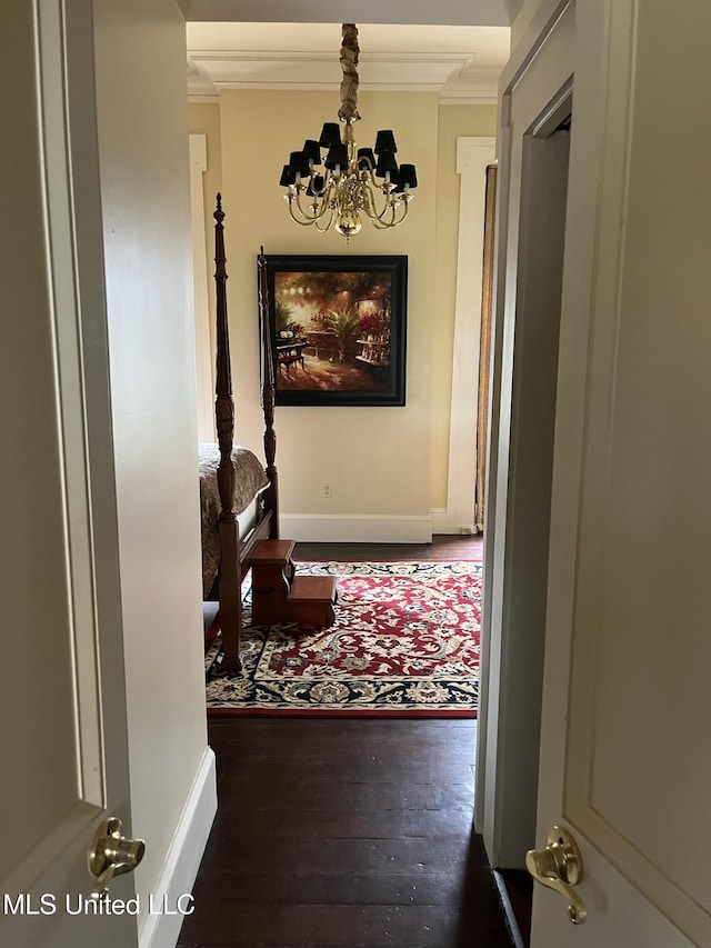 305 N Rankin St, Natchez, MS 39120 - corridor featuring dark hardwood / wood-style floors, crown molding, and a notable chandelier