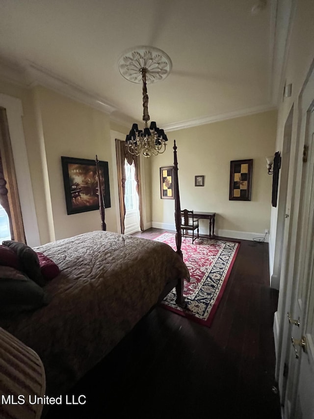 305 N Rankin St, Natchez, MS 39120 - bedroom featuring hardwood / wood-style floors, a notable chandelier, and ornamental molding