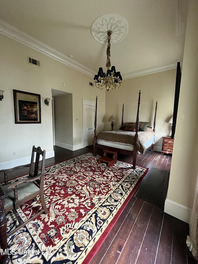 305 N Rankin St, Natchez, MS 39120 - bedroom featuring dark hardwood / wood-style floors, ornamental molding, and a chandelier