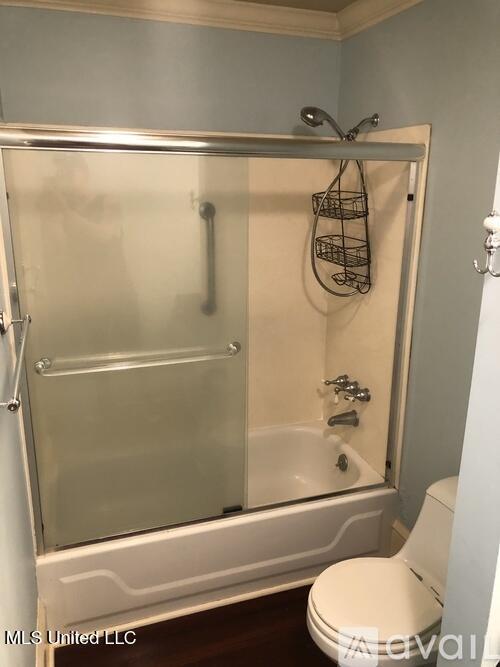 305 N Rankin St, Natchez, MS 39120 - bathroom with toilet, crown molding, and enclosed tub / shower combo