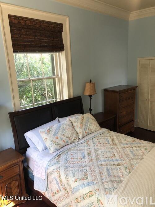 305 N Rankin St, Natchez, MS 39120 - bedroom with hardwood / wood-style floors and ornamental molding
