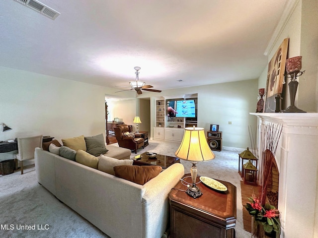 living room featuring ceiling fan and light colored carpet