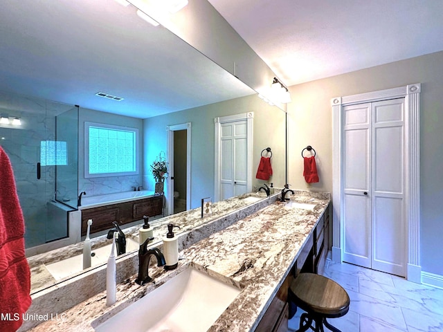 full bathroom with separate shower and tub, vanity, and toilet