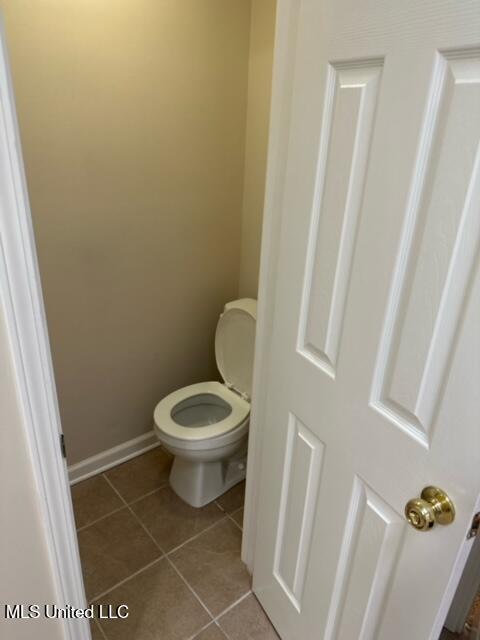 202 Kilford Ct, Madison, MS 39110 - bathroom featuring tile patterned floors, toilet, and baseboards
