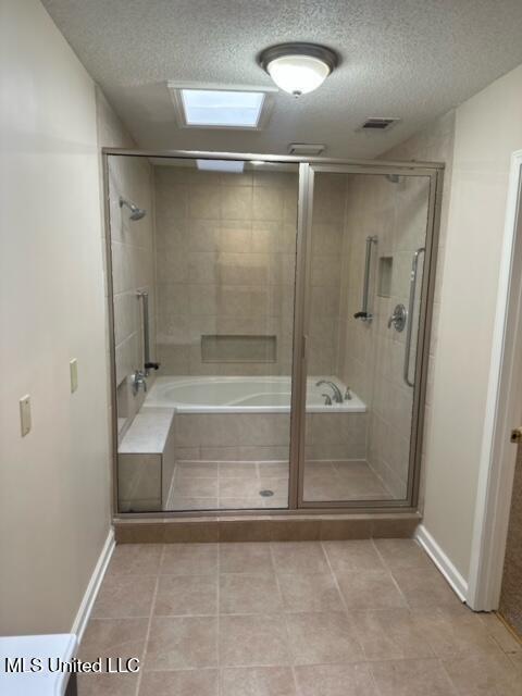 202 Kilford Ct, Madison, MS 39110 - full bath with a textured ceiling, a shower with shower door, baseboards, and tile patterned floors