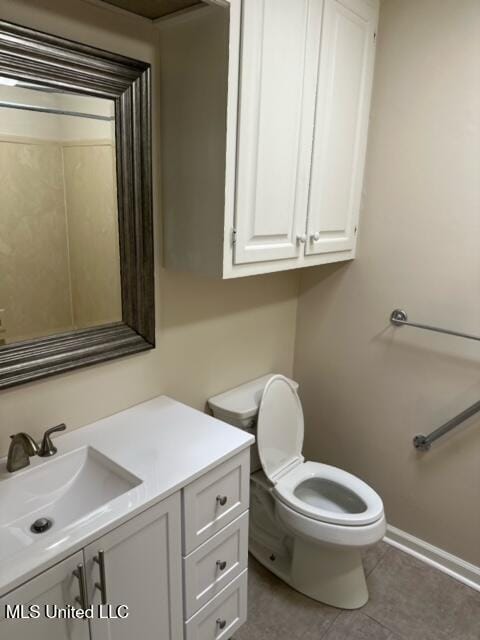 202 Kilford Ct, Madison, MS 39110 - bathroom with vanity, toilet, baseboards, and tile patterned floors