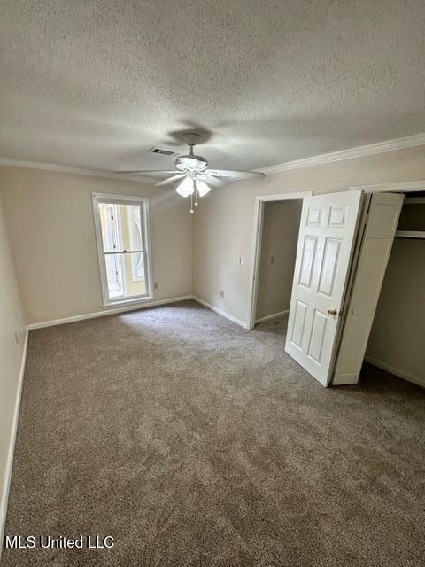 202 Kilford Ct, Madison, MS 39110 - unfurnished bedroom with carpet flooring, a textured ceiling, ornamental molding, baseboards, and ceiling fan