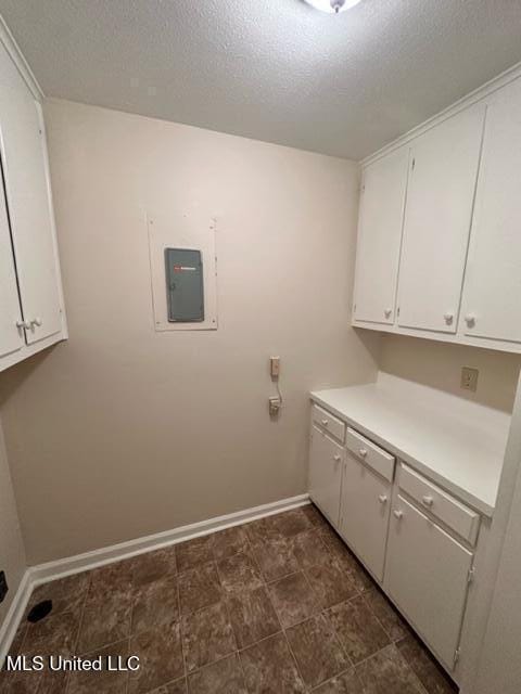 202 Kilford Ct, Madison, MS 39110 - laundry area with electric panel, baseboards, and a textured ceiling