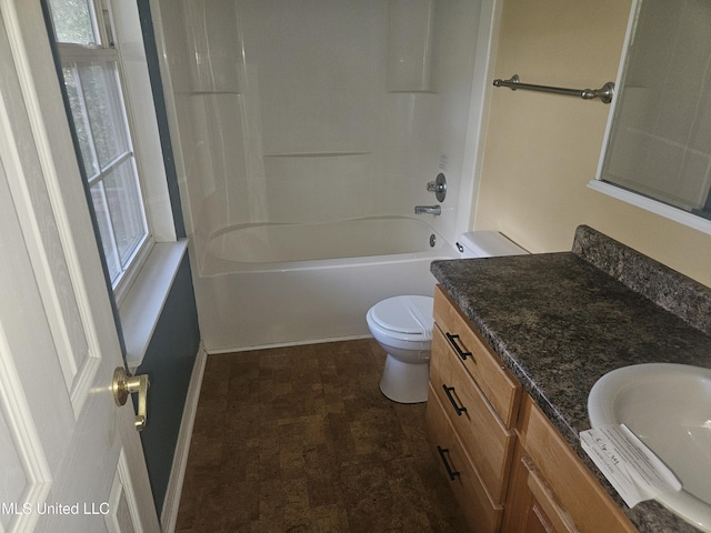 full bathroom with toilet, vanity, a wealth of natural light, and washtub / shower combination