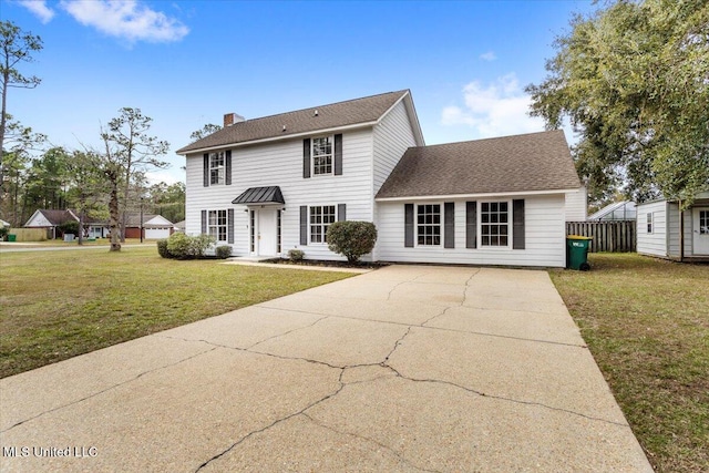 colonial-style house with a front yard