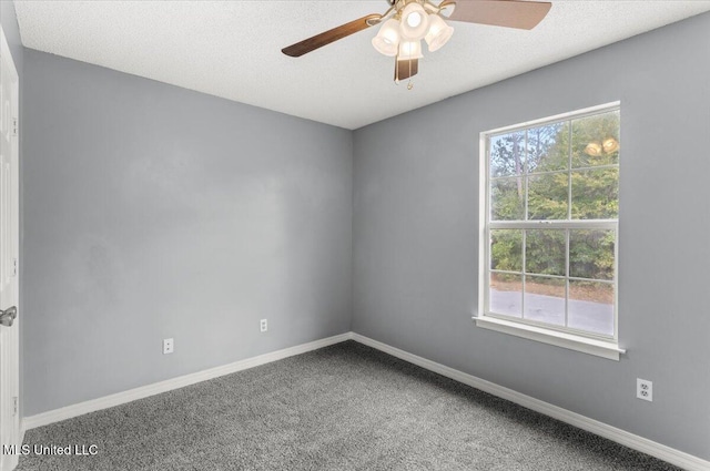 empty room featuring carpet flooring and ceiling fan