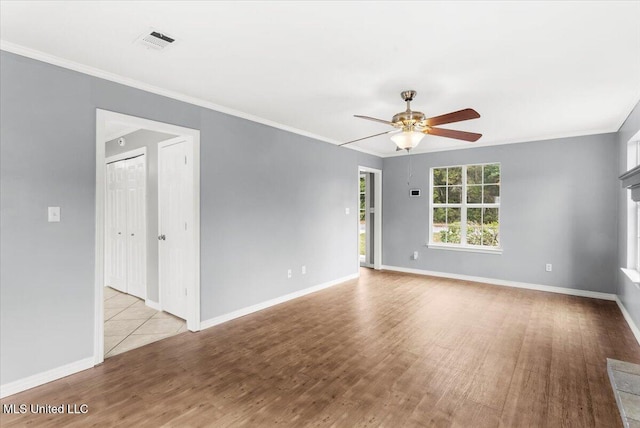 unfurnished room with ceiling fan and light wood-type flooring