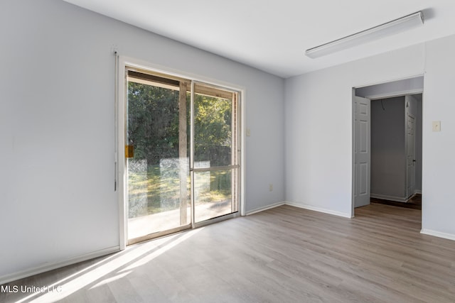 empty room with light wood-type flooring