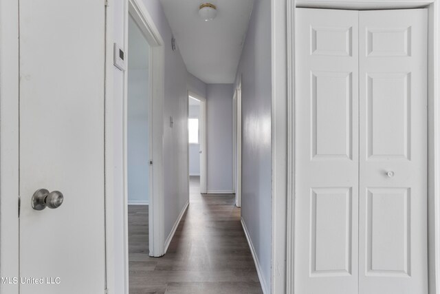 corridor with dark hardwood / wood-style floors