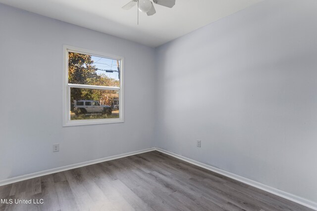 empty room with ceiling fan and wood-type flooring