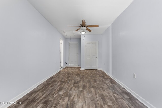 empty room featuring dark wood-type flooring