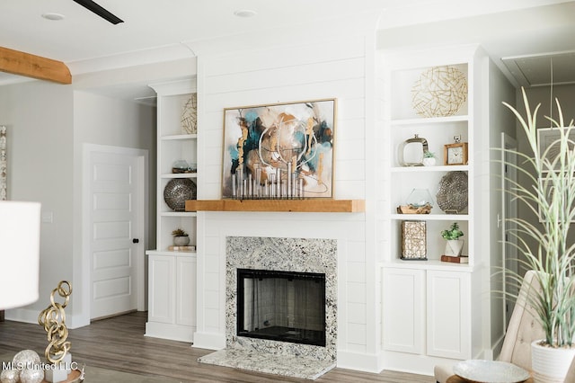 16043 W Dedeaux Rd, Gulfport, MS 39503 - living area with wood finished floors, a fireplace, built in features, and attic access