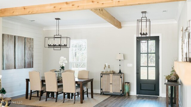 16043 W Dedeaux Rd, Gulfport, MS 39503 - dining room featuring beamed ceiling, wood finished floors, a chandelier, and ornamental molding