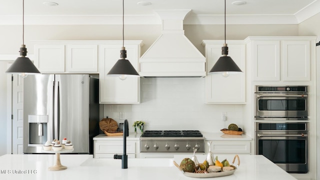 16043 W Dedeaux Rd, Gulfport, MS 39503 - kitchen with stainless steel appliances, custom exhaust hood, tasteful backsplash, light countertops, and white cabinets