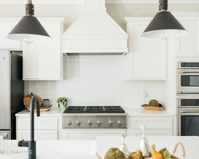 16043 W Dedeaux Rd, Gulfport, MS 39503 - kitchen with custom exhaust hood, appliances with stainless steel finishes, light countertops, and tasteful backsplash