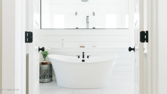 16043 W Dedeaux Rd, Gulfport, MS 39503 - full bath with a soaking tub and tile patterned flooring