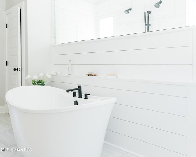 16043 W Dedeaux Rd, Gulfport, MS 39503 - bathroom featuring a soaking tub