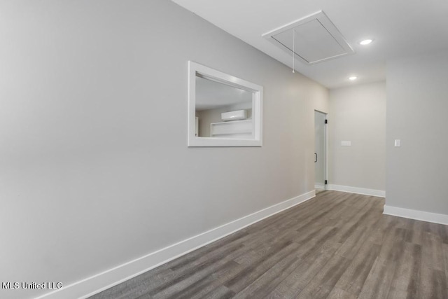16043 W Dedeaux Rd, Gulfport, MS 39503 - spare room with attic access, wood finished floors, and recessed lighting
