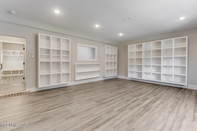 16043 W Dedeaux Rd, Gulfport, MS 39503 - empty room featuring wood finished floors, a smoke detector, and recessed lighting